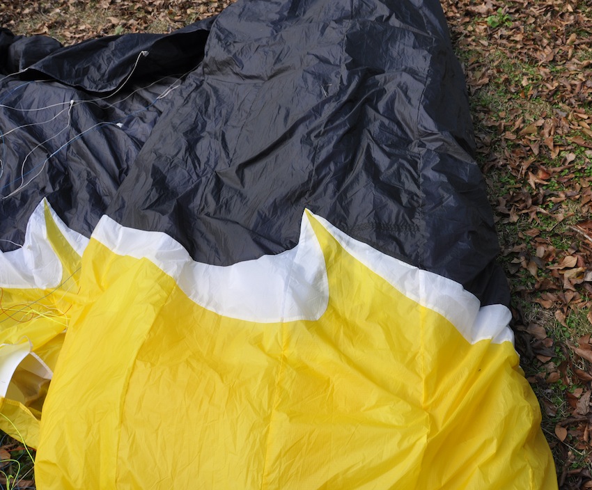 paraglider repair on an ozone after a rip in the cells